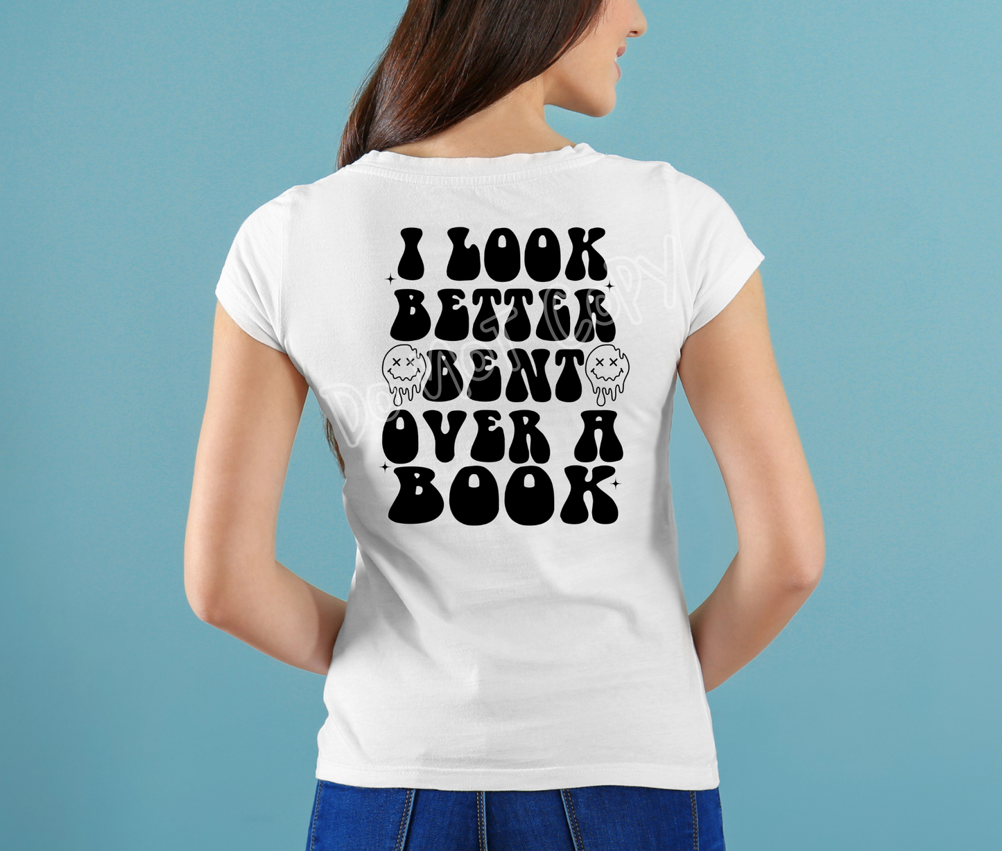 BENT OVER A BOOK TEE