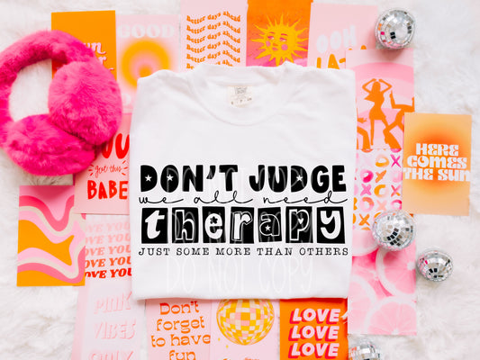 WE ALL NEED THERAPY TEE